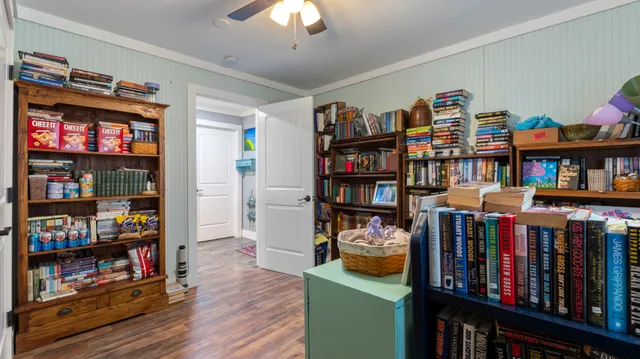 a living room with lots of books