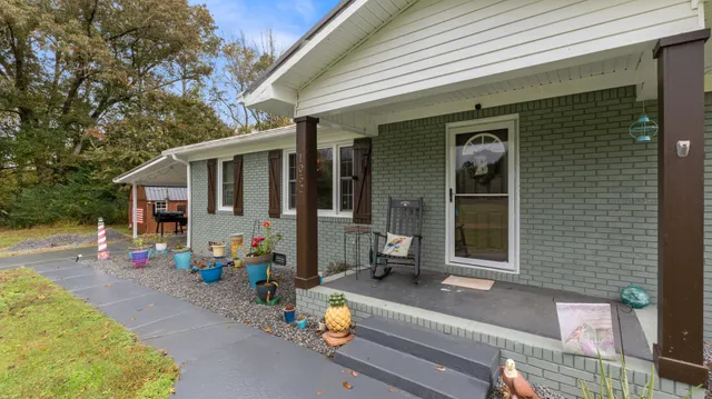 a front view of a house with a sitting area