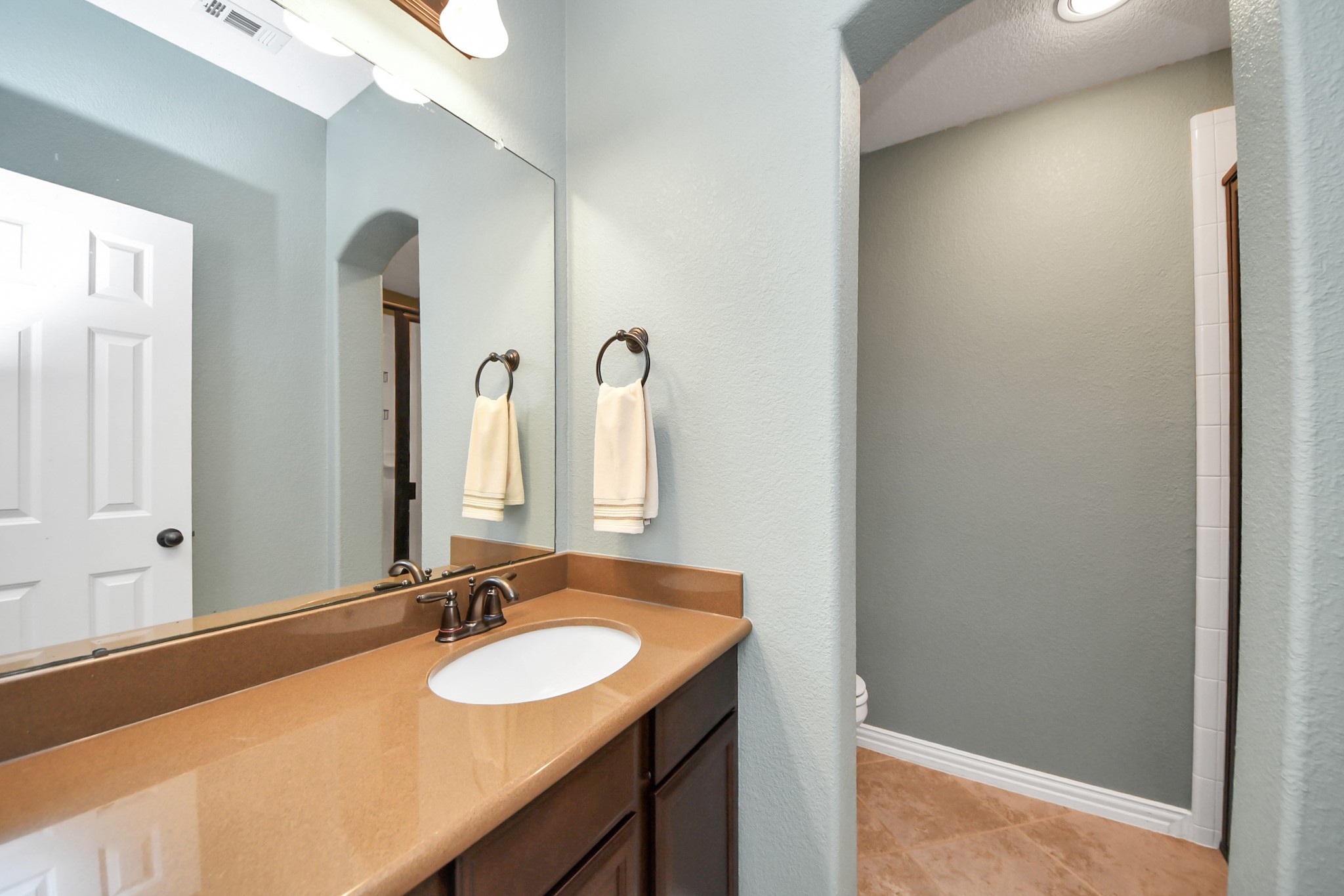 3115 Currant Drive Manvel, TX 77578 - Photo 40 of 48 Third full bath, adjacent to bedroom 4 with a standup shower just past the opening in the photo on the right side