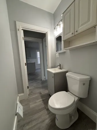 a bathroom with a toilet and a sink