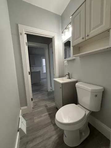 a bathroom with a toilet and a sink