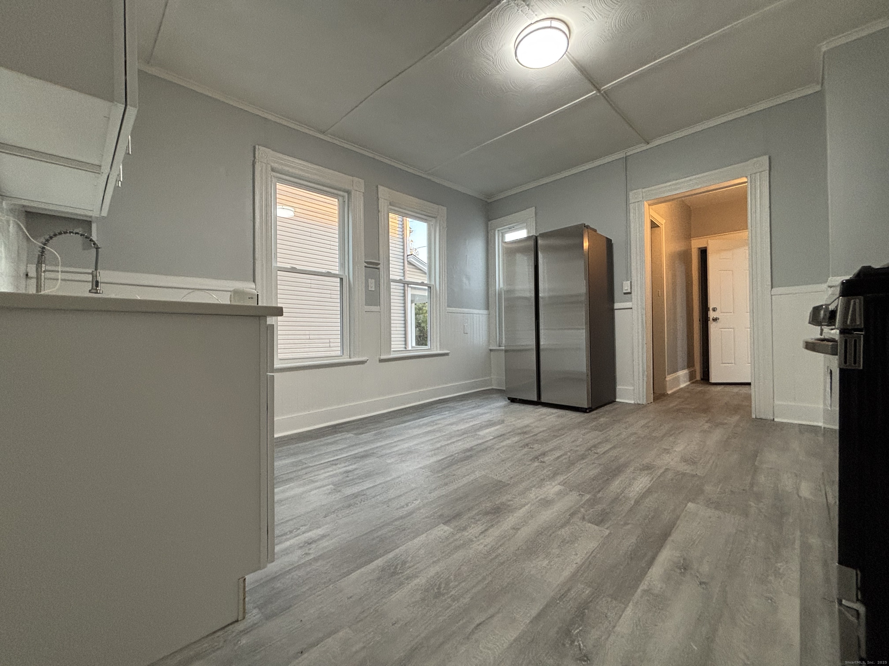 Undisclosed Address Bridgeport, CT 06605 - Photo 16 of 18 a view of an empty room with a window