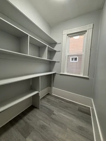 a view of an empty room with a window