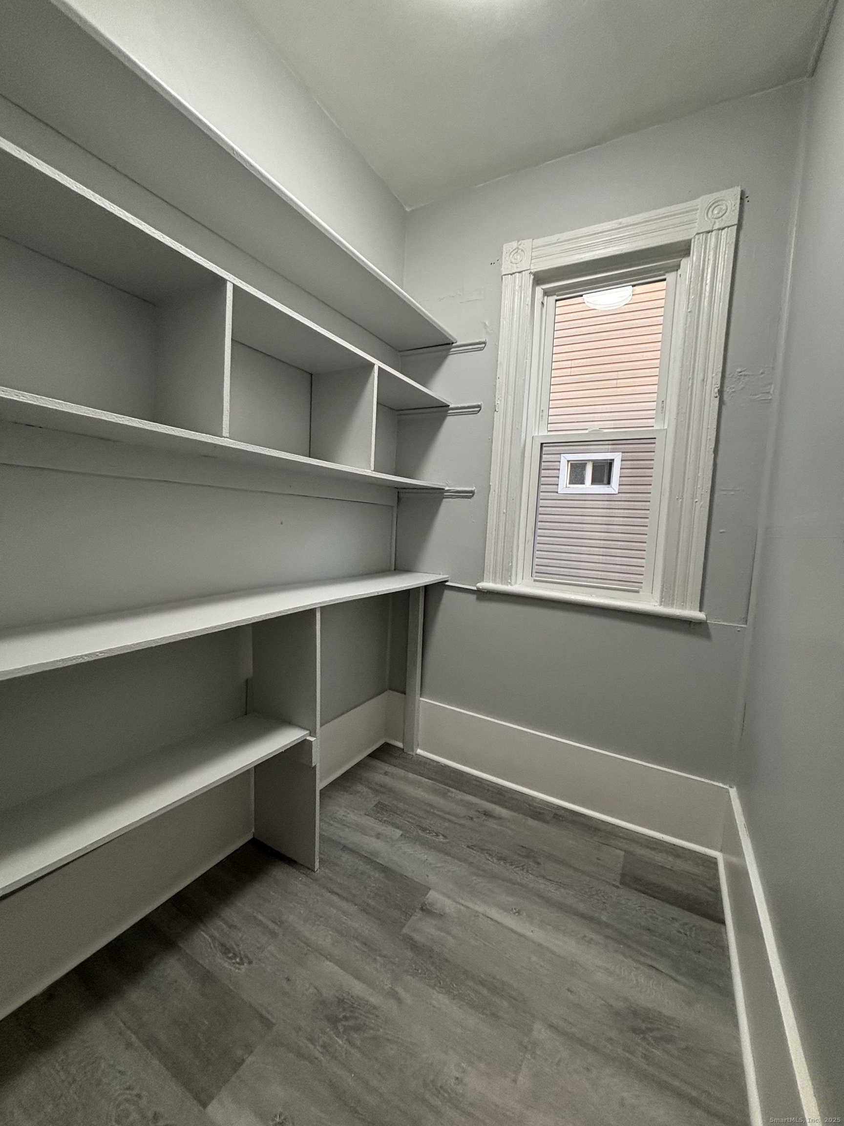 Undisclosed Address Bridgeport, CT 06605 - Photo 7 of 18 a view of an empty room with a window