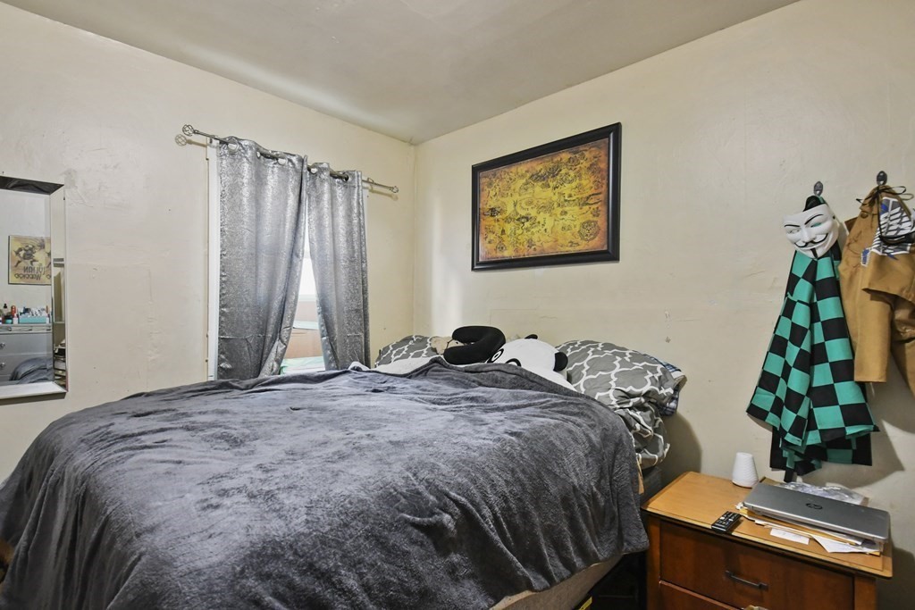 52 Crystal Street Worcester, MA 01603 - Photo 12 of 29 a bedroom with bed and a window