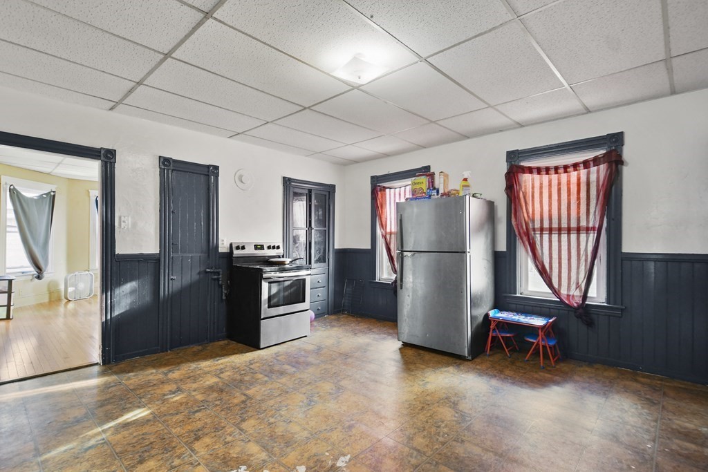 52 Crystal Street Worcester, MA 01603 - Photo 15 of 29 a kitchen with refrigerator and window