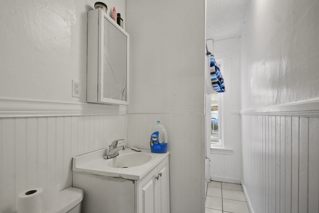 52 Crystal Street Worcester, MA 01603 - Photo 19 of 29 a bathroom with a sink toilet and vanity