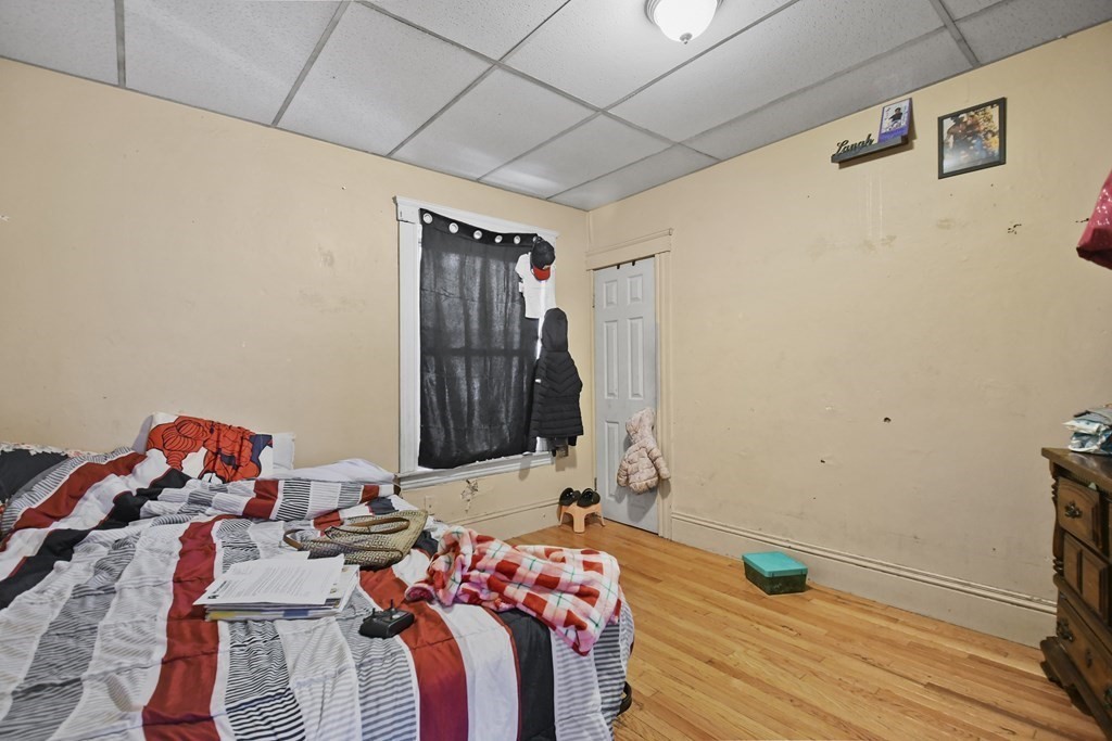 52 Crystal Street Worcester, MA 01603 - Photo 20 of 29 a bedroom with a bed and a window