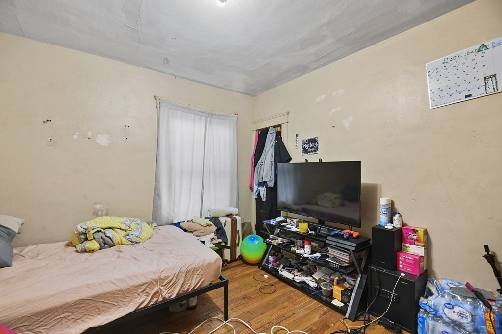 52 Crystal Street Worcester, MA 01603 - Photo 23 of 29 a bedroom with a bed and a flat screen tv