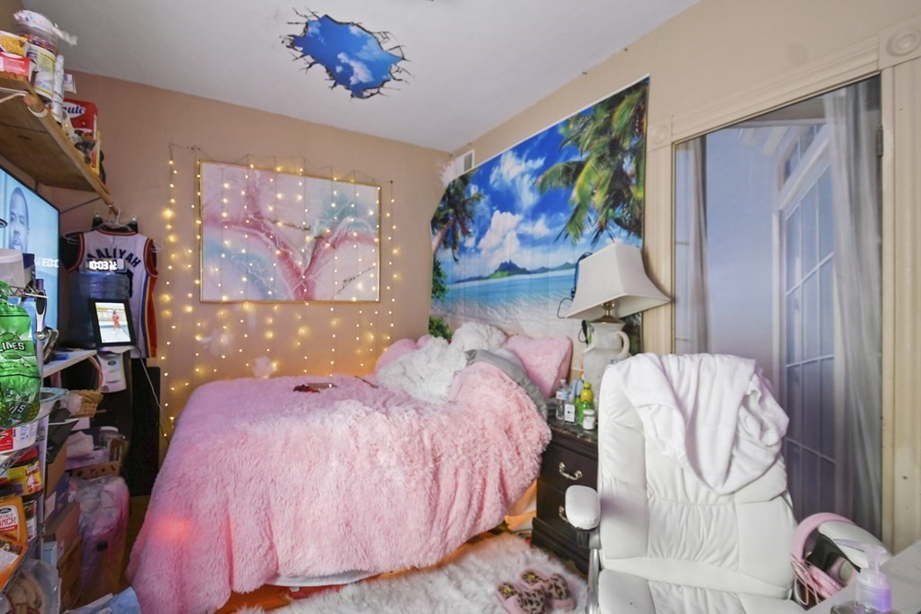 52 Crystal Street Worcester, MA 01603 - Photo 26 of 29 a bed room with two bed and a painting on the wall