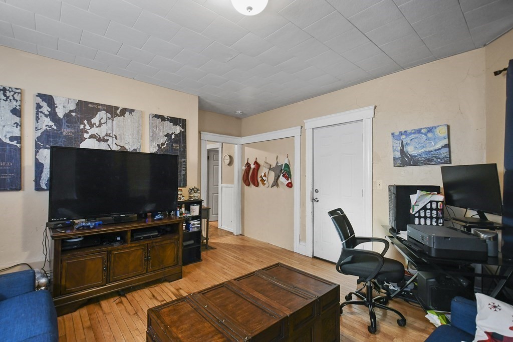 52 Crystal Street Worcester, MA 01603 - Photo 4 of 29 a living room with furniture and a flat screen tv