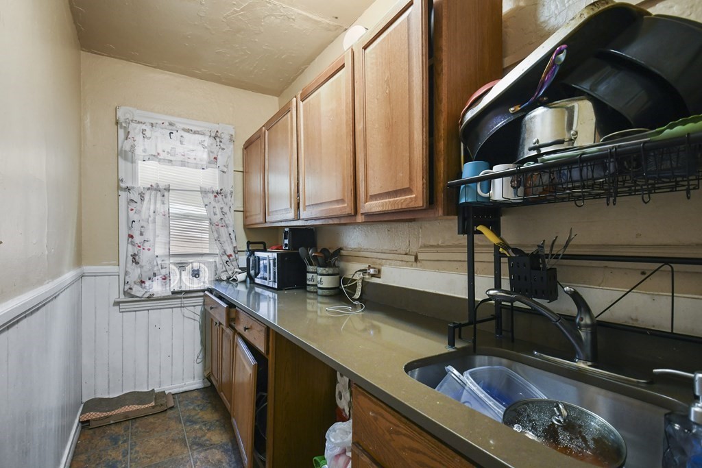52 Crystal Street Worcester, MA 01603 - Photo 8 of 29 a kitchen with a sink cabinets and appliances