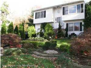 2816 Shafto Road Tinton Falls, NJ 07753 - Photo 1 of 24 a front view of a house with a yard