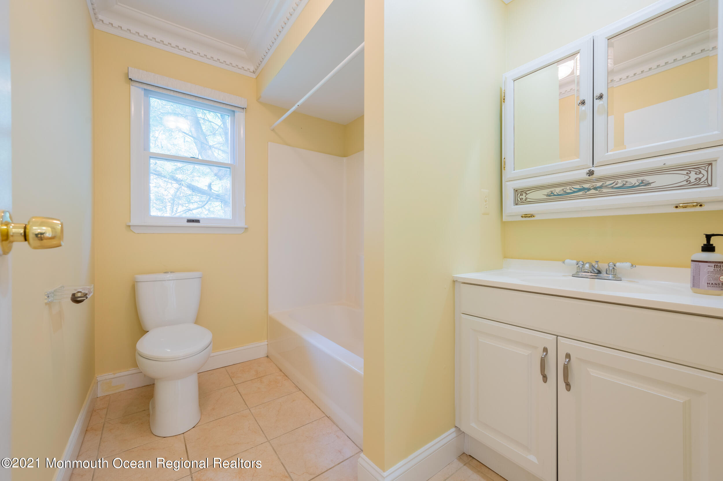2816 Shafto Road Tinton Falls, NJ 07753 - Photo 12 of 24 a bathroom with a toilet sink and mirror