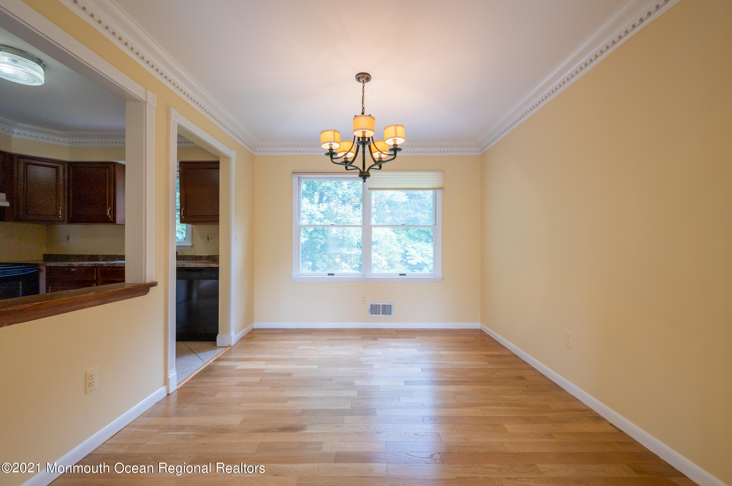 2816 Shafto Road Tinton Falls, NJ 07753 - Photo 13 of 24 a view of a hallway with wooden floor and a window