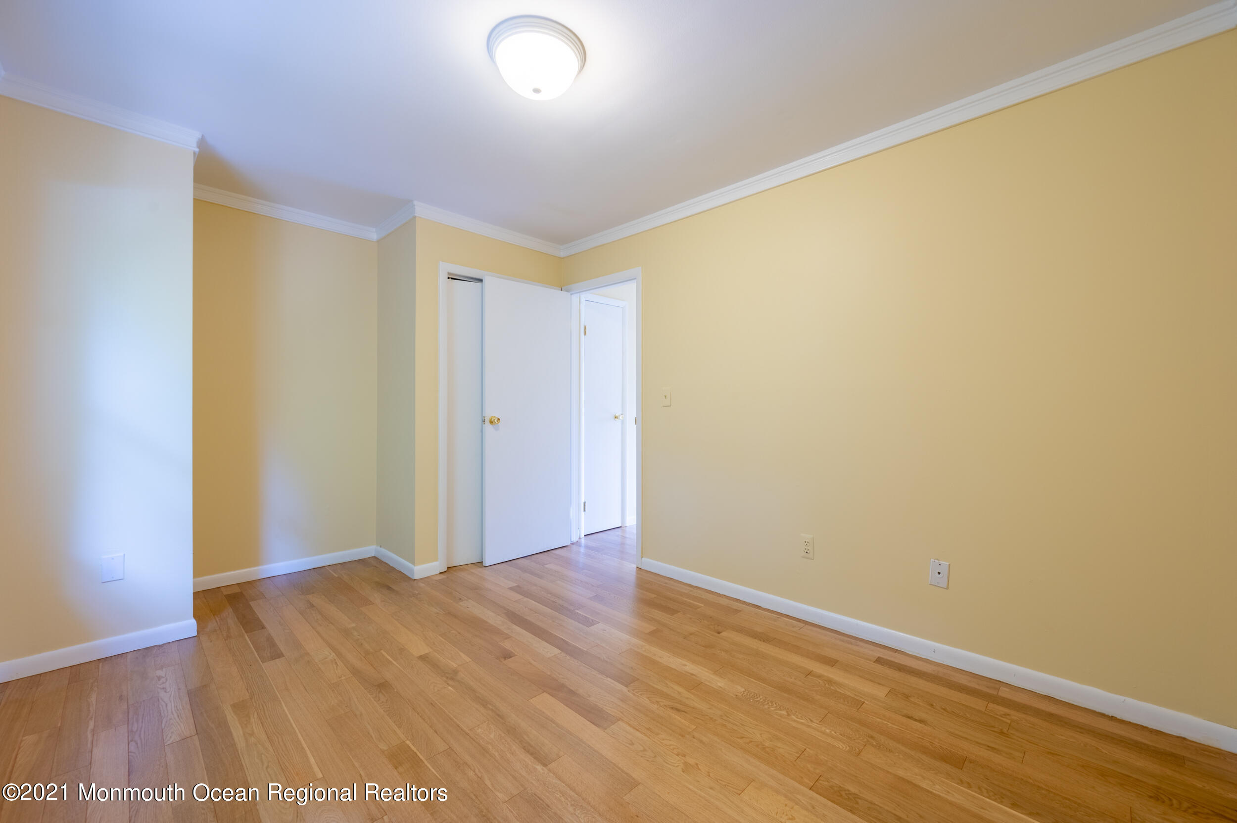 2816 Shafto Road Tinton Falls, NJ 07753 - Photo 17 of 24 an empty room with wooden floor