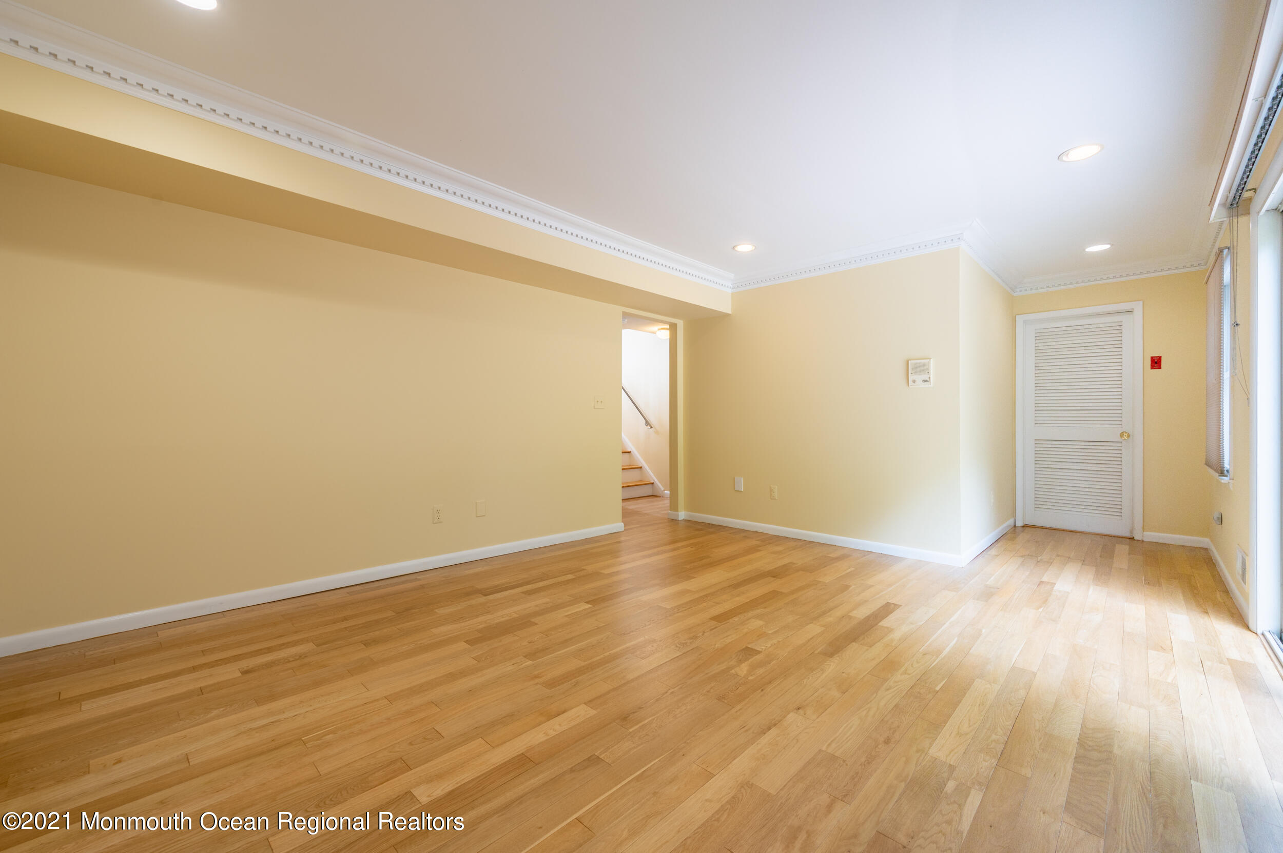 2816 Shafto Road Tinton Falls, NJ 07753 - Photo 21 of 24 a view of an empty room and wooden floor