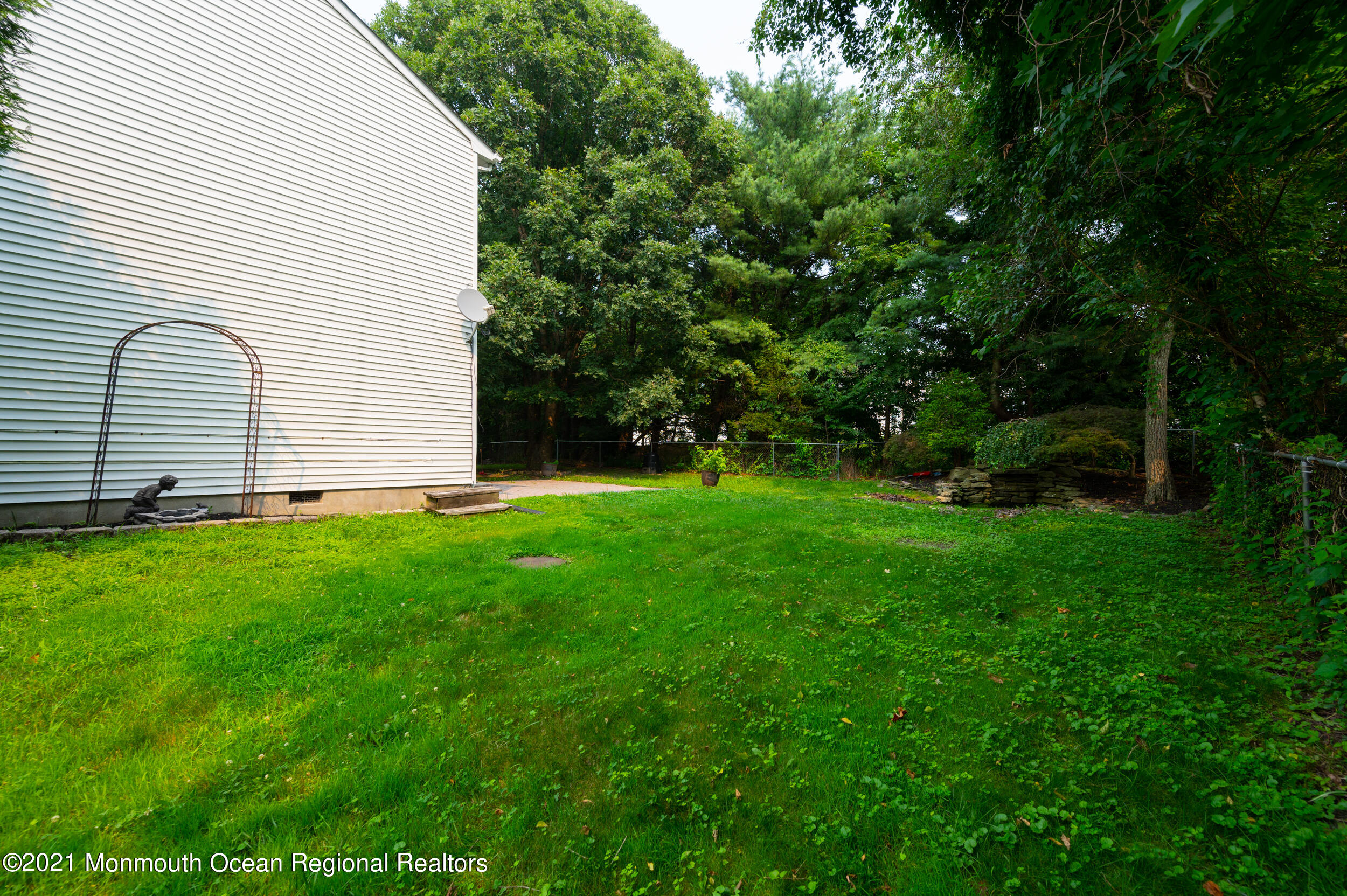 2816 Shafto Road Tinton Falls, NJ 07753 - Photo 23 of 24 a view of an house with backyard space and garden