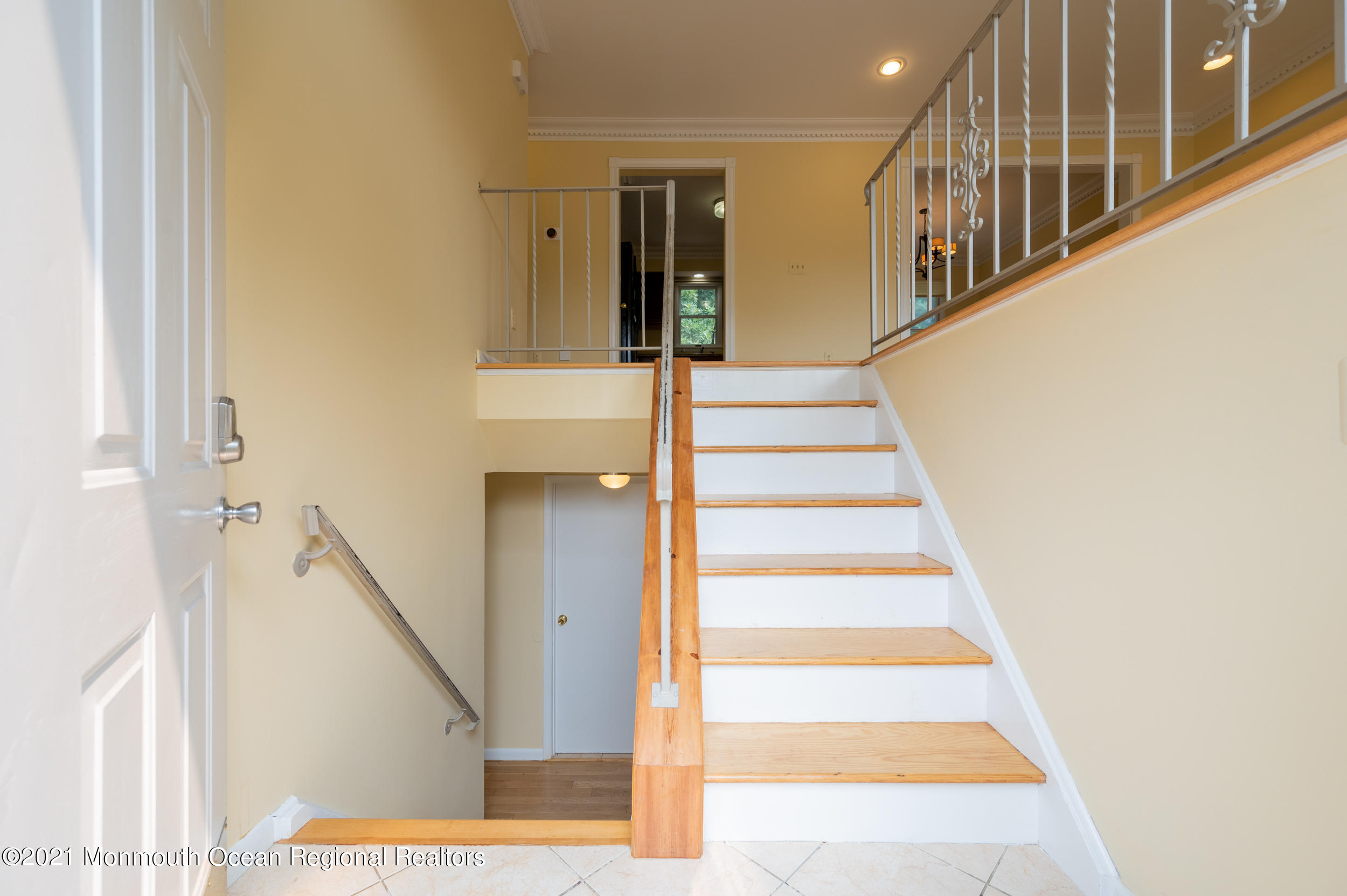 2816 Shafto Road Tinton Falls, NJ 07753 - Photo 4 of 24 a view of staircase with white walls and a window