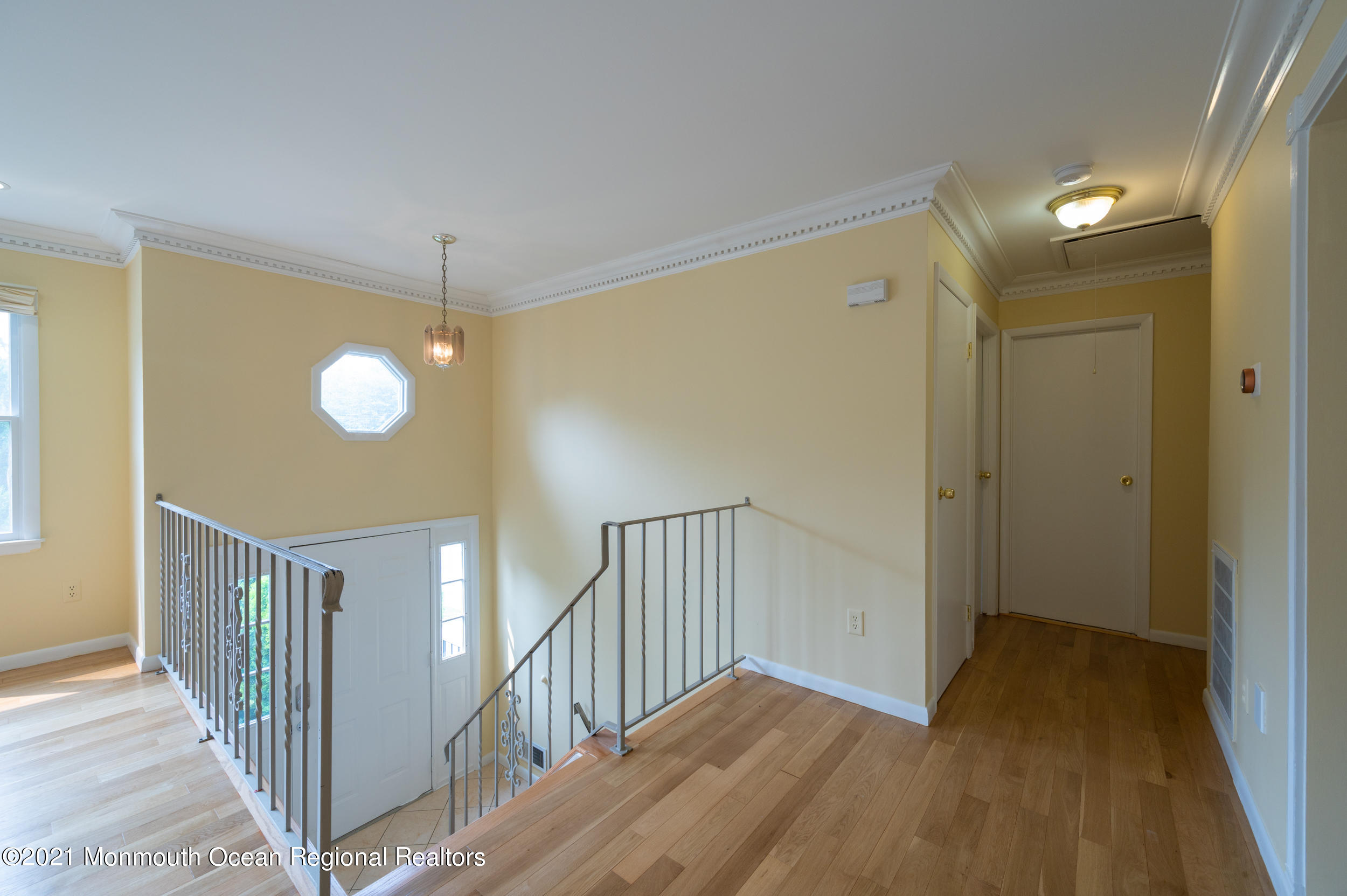 2816 Shafto Road Tinton Falls, NJ 07753 - Photo 5 of 24 a view of a hallway with wooden floor