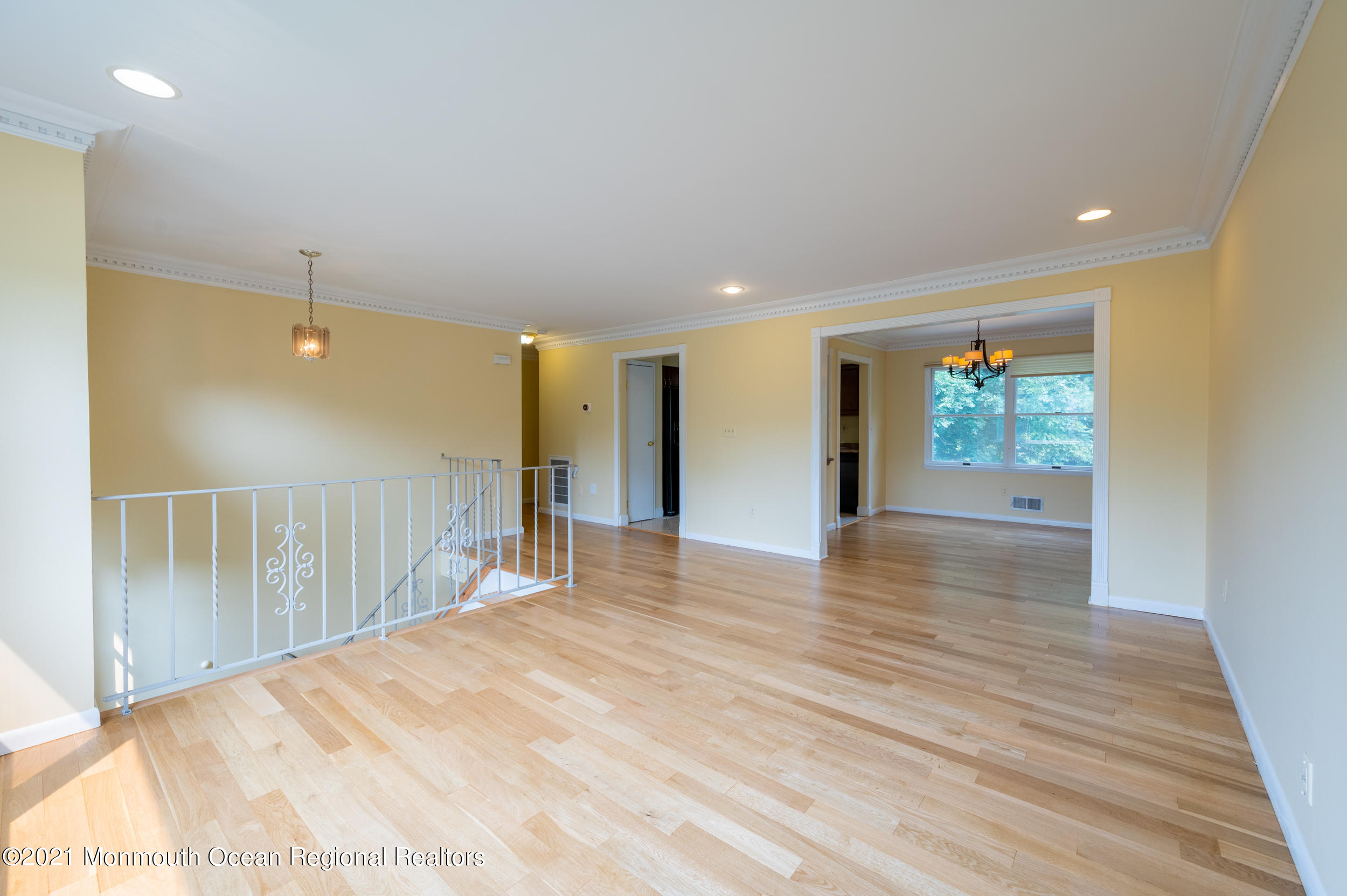 2816 Shafto Road Tinton Falls, NJ 07753 - Photo 6 of 24 a view of a hallway with wooden floor and windows
