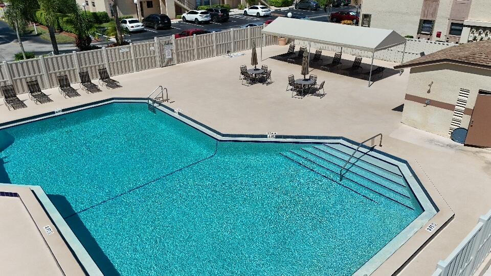 9480 Boca Cove Circle, Unit 416 Boca Raton, FL 33428 - Photo 12 of 15 a view of a backyard with sitting area