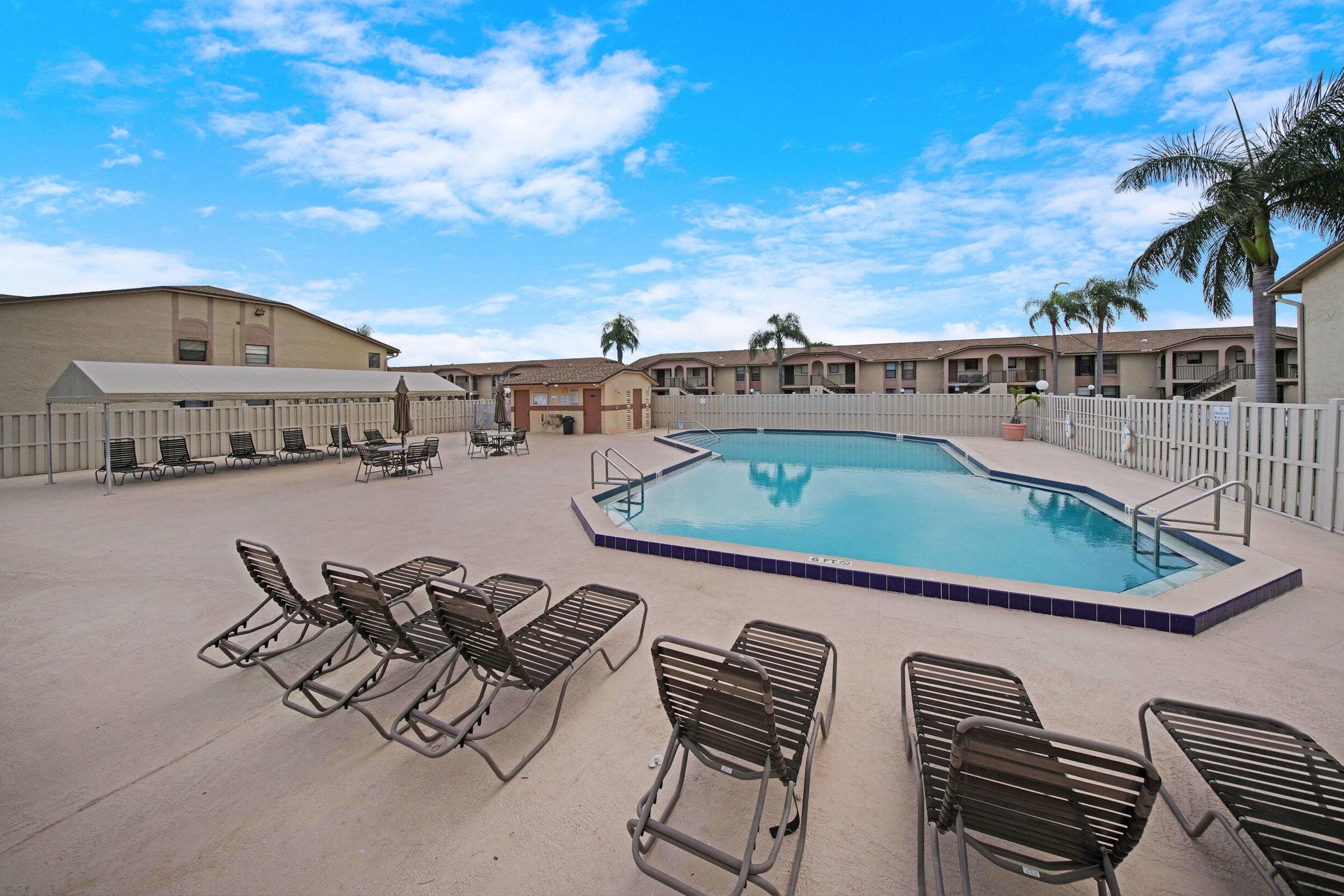 9480 Boca Cove Circle, Unit 416 Boca Raton, FL 33428 - Photo 15 of 15 an outdoor view with patio