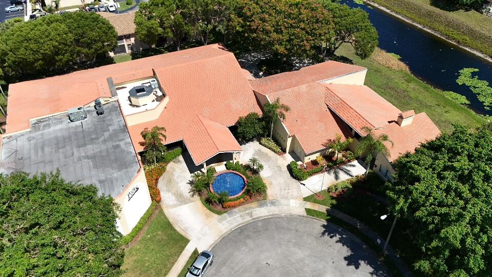 9480 Boca Cove Circle, Unit 416 Boca Raton, FL 33428 - Photo 4 of 15 an aerial view of a house with yard and patio
