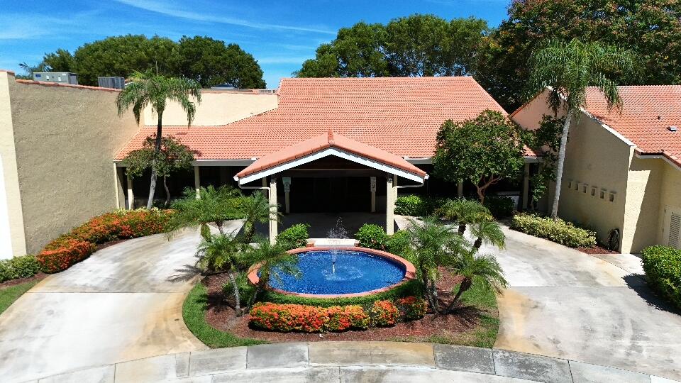 9480 Boca Cove Circle, Unit 416 Boca Raton, FL 33428 - Photo 6 of 15 a view of a house with yard and garden