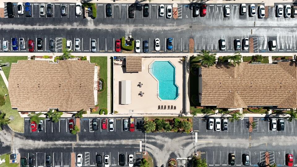 9480 Boca Cove Circle, Unit 416 Boca Raton, FL 33428 - Photo 10 of 15 a close view of water kitchen with stainless steel refrigerator and dining table