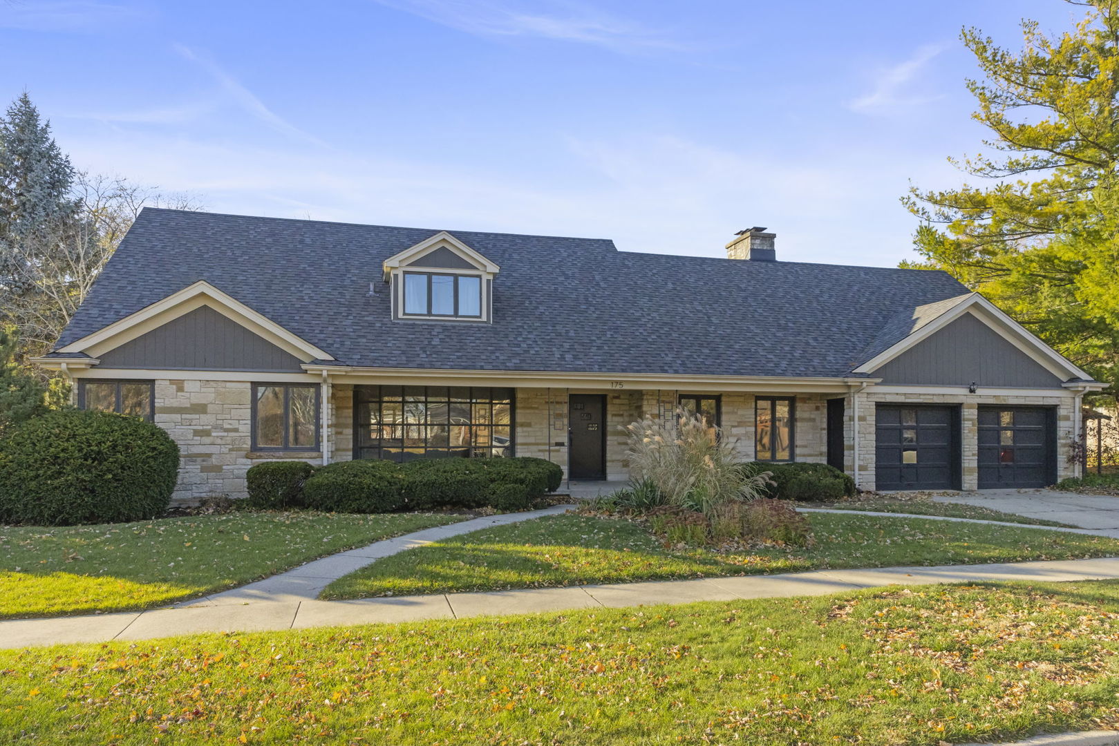 a front view of a house with garden