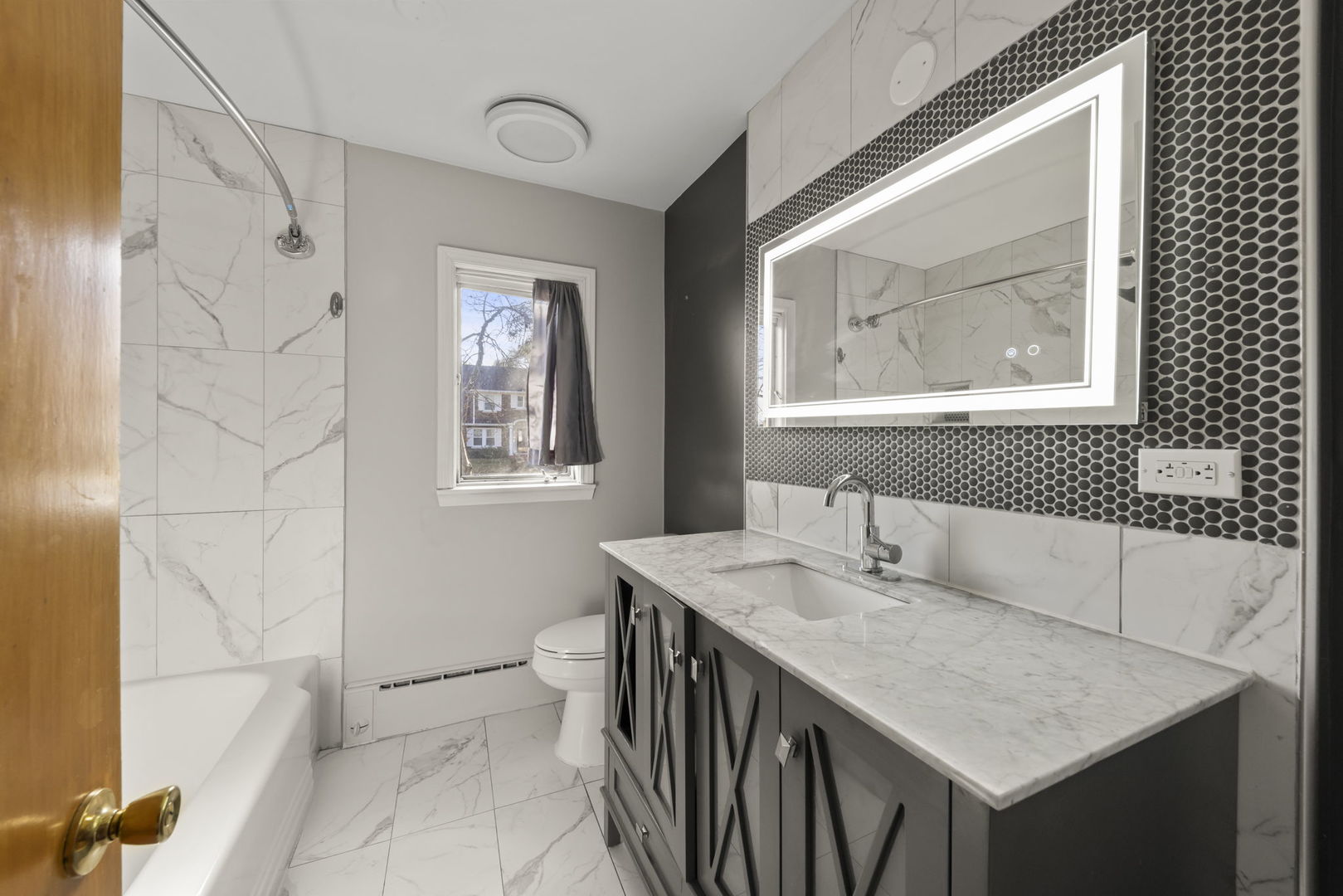 175 South Harrison Avenue Aurora, IL 60506 - Photo 15 of 25 a bathroom with a sink a mirror and a toilet