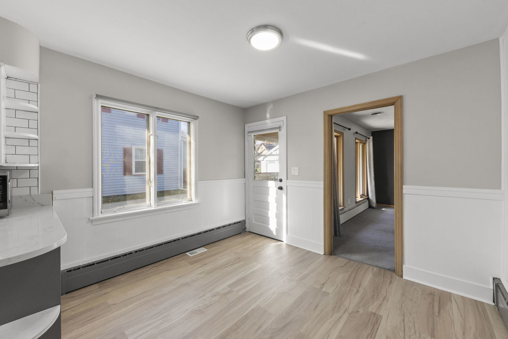 175 South Harrison Avenue Aurora, IL 60506 - Photo 8 of 25 wooden floor in an empty room with a window