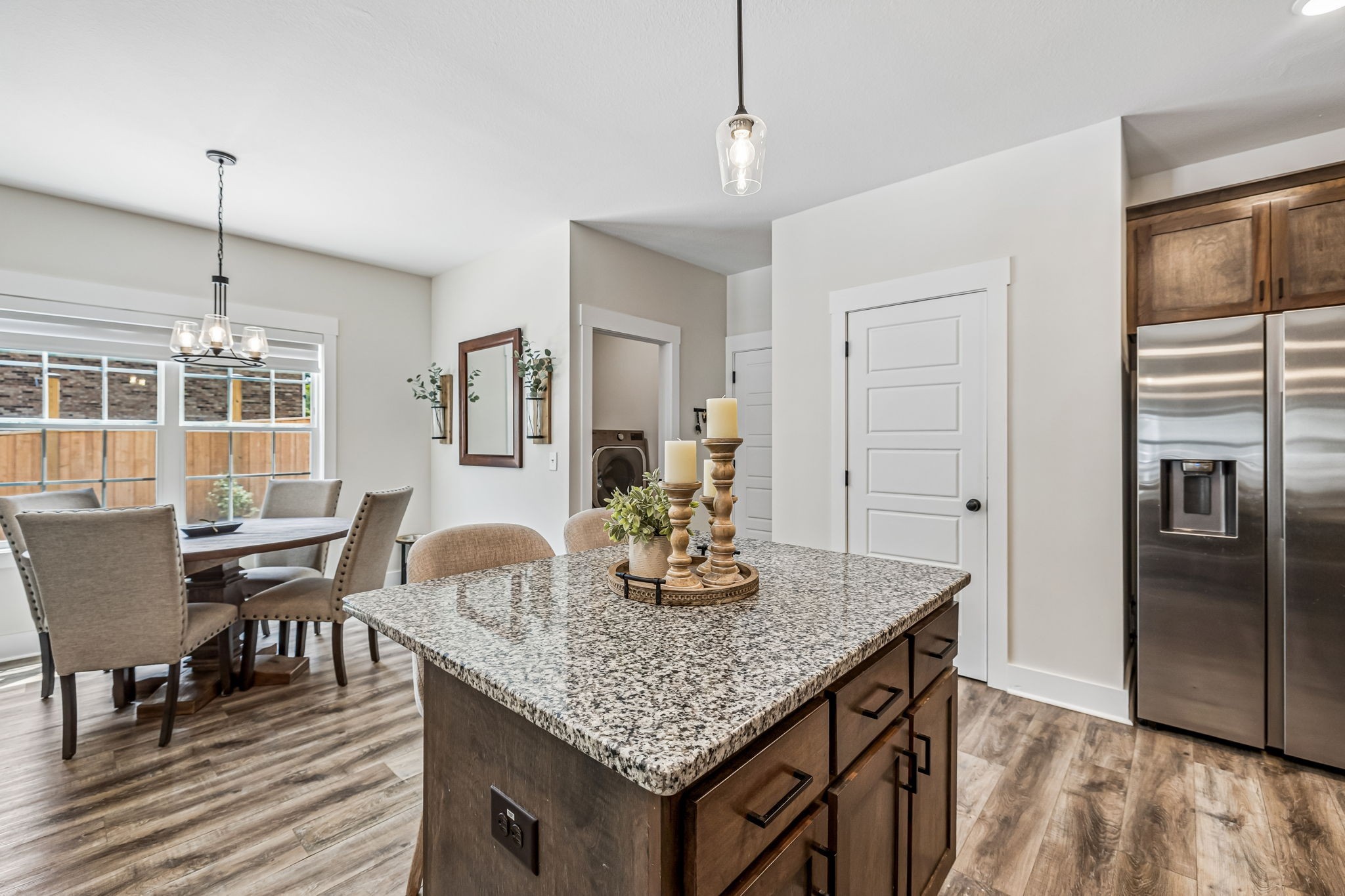 1845 Dinsmore Road Clarksville, TN 37040 - Photo 10 of 36 a kitchen with granite countertop kitchen island stainless steel appliances a table and chairs in it