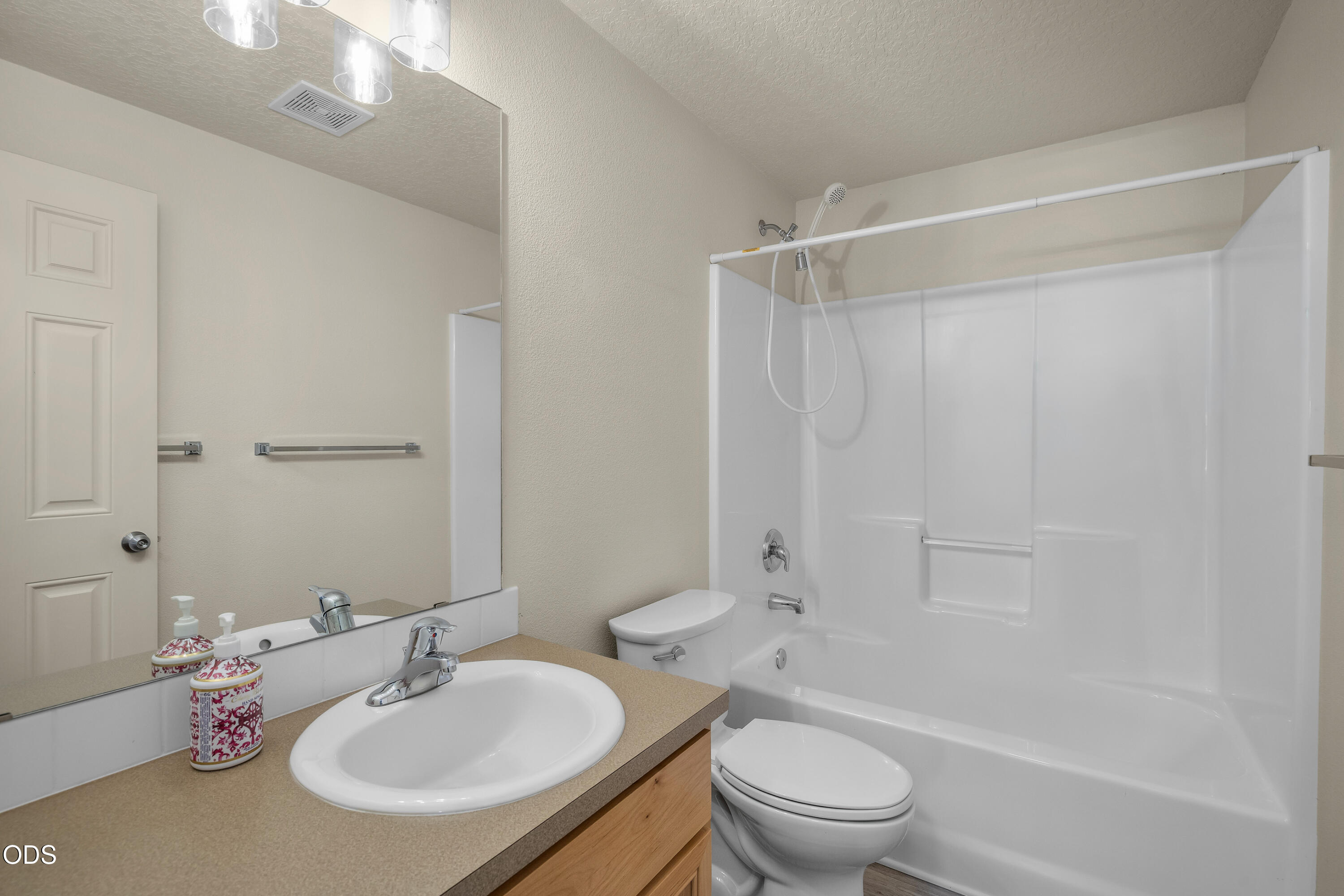 20535 Sunderland Way Bend, OR 97701 - Photo 32 of 41 a bathroom with a sink toilet and shower