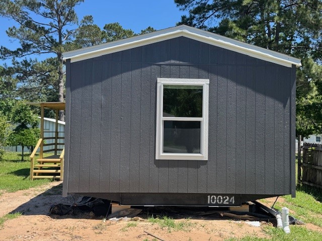 21071 Pinetex Street New Caney, TX 77357 - Photo 1 of 12 a front view of a house with a yard
