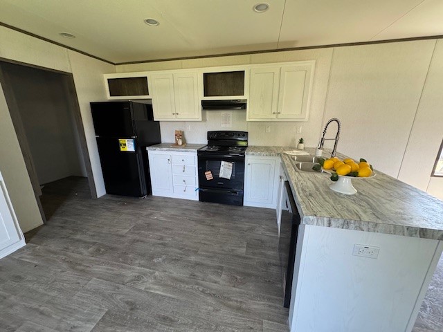 21071 Pinetex Street New Caney, TX 77357 - Photo 4 of 12 a kitchen with stainless steel appliances granite countertop a refrigerator and a stove top oven
