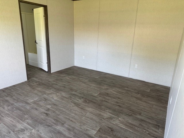 21071 Pinetex Street New Caney, TX 77357 - Photo 6 of 12 a view of a room with wooden floor