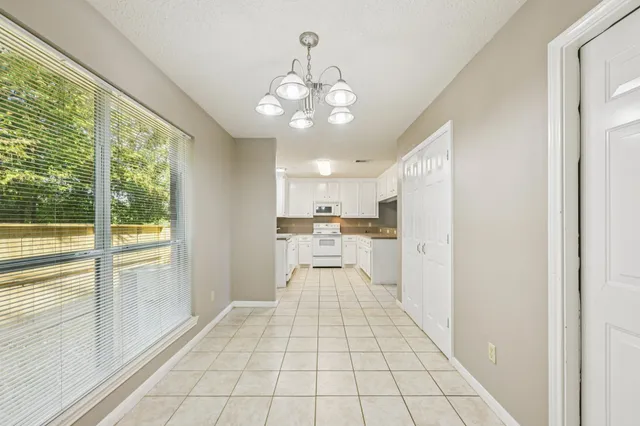 a view of a living room with a large window