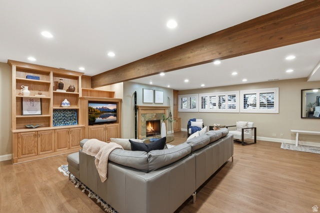 3674 Oak Rim Way Salt Lake City, UT 84109 - Photo 25 of 47 Spacious living area featuring warm wood-finish flooring, recessed lighting, and exposed wood beam accents