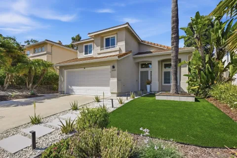 front view of a house with a yard