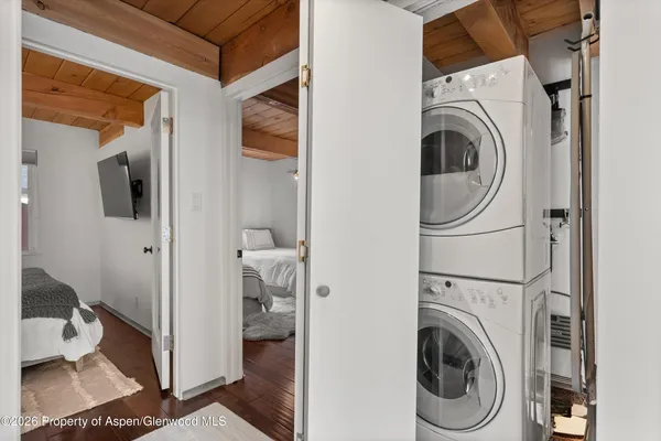a view of a hallway with washer and dryer