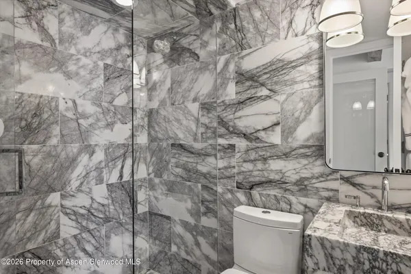 a bathroom with a toilet and a sink