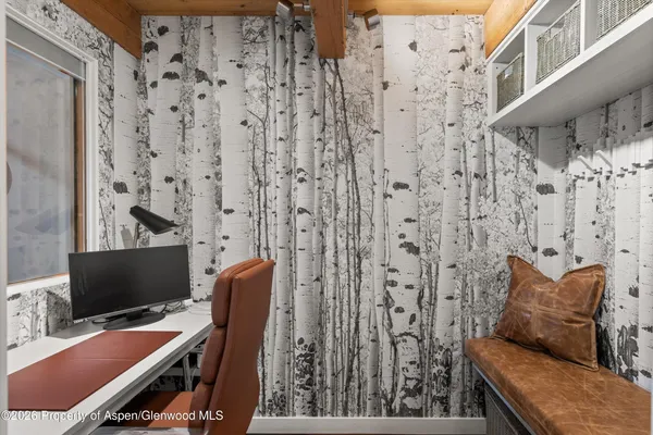 a view of a livingroom with furniture and a flat screen tv