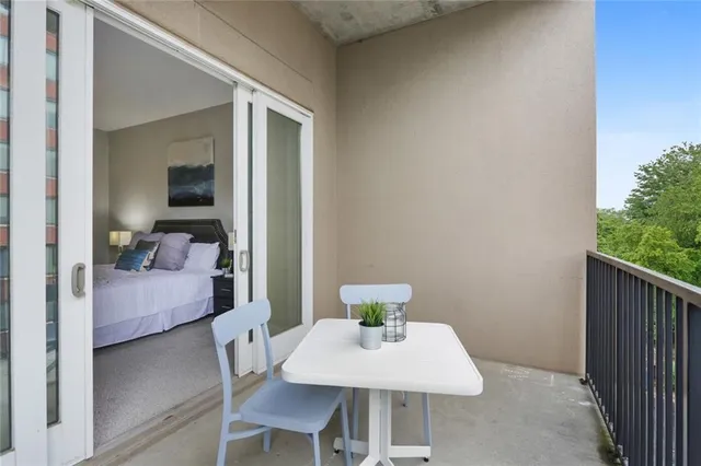 a view of a room that has a table and chair in it