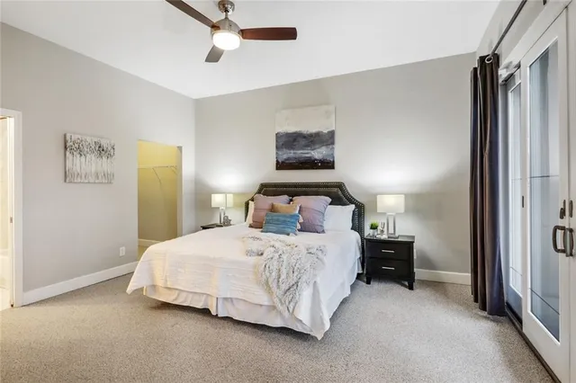 a bedroom with a bed and a night stand