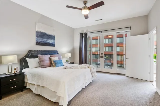 a bedroom with a large bed and a window