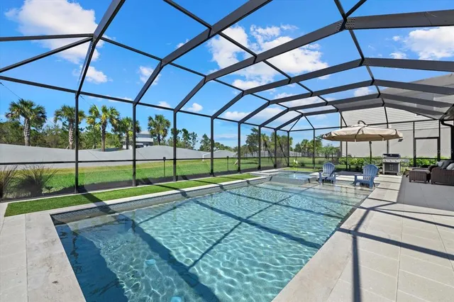 an aerial view of a pool patio and outdoor seating