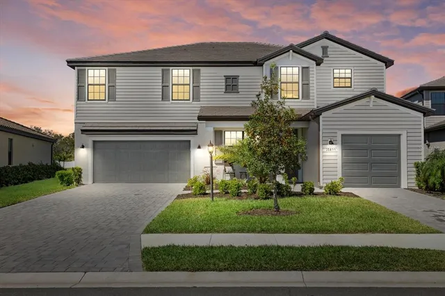 an aerial view of a swimming pool outdoor seating and yard