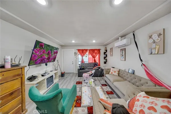 a room with furniture and wooden floor